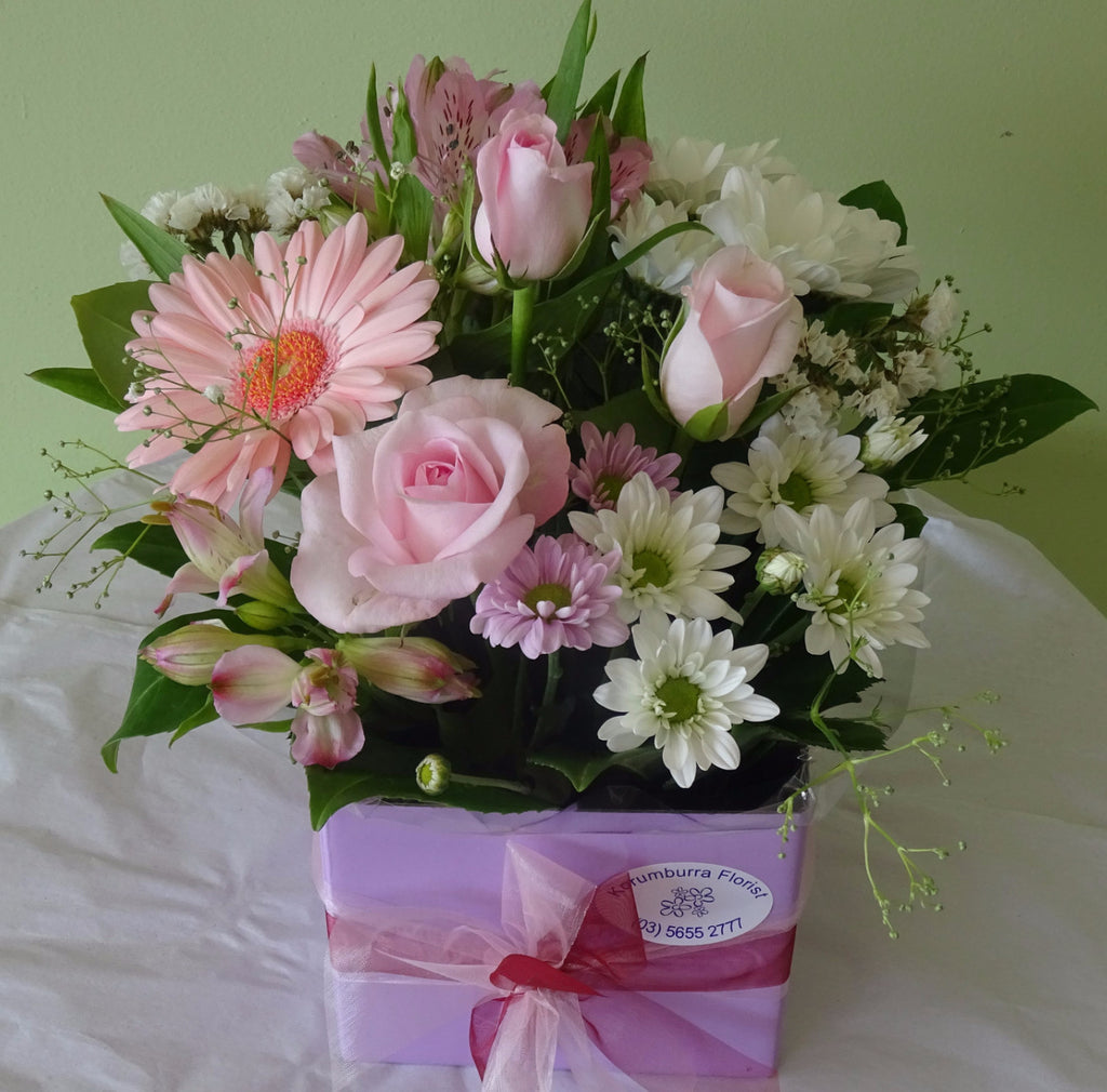 Flower arrangement of flowers with roses, gerberas, alstromeria and chrysanthemums