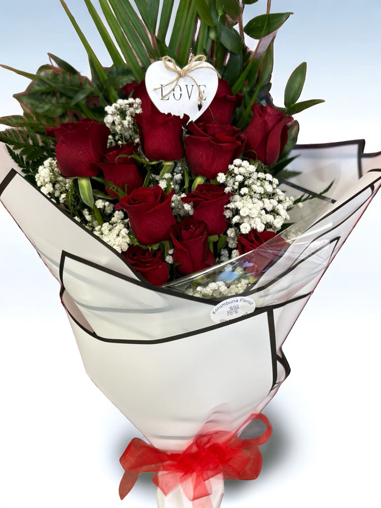 12 (dozen) long stemmed Roses in a sheaf style. Great gift for that special someone!